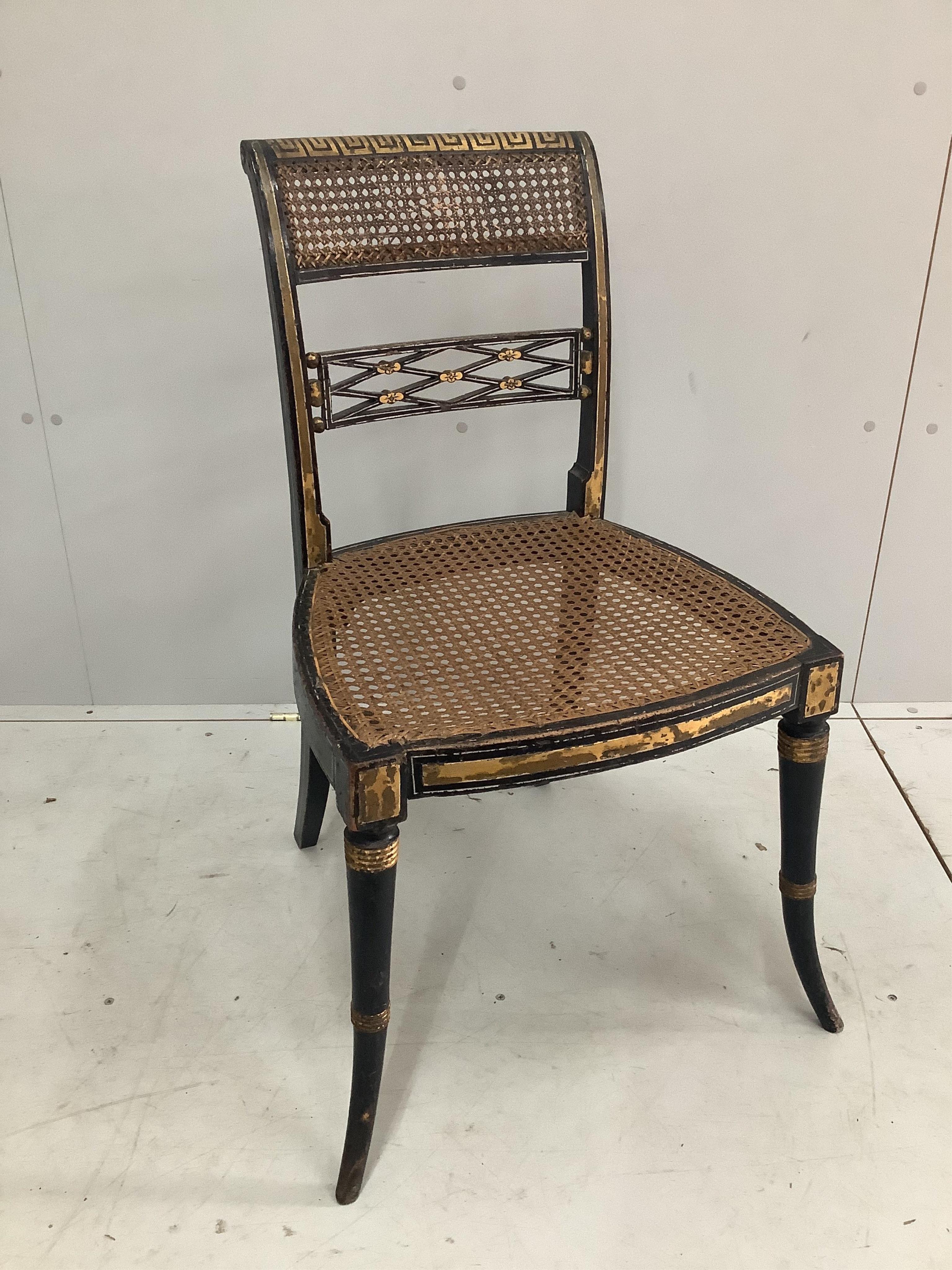 A Regency caned parcel gilt dining chair, width 48cm, depth 45cm, height 87cm. Condition - fair